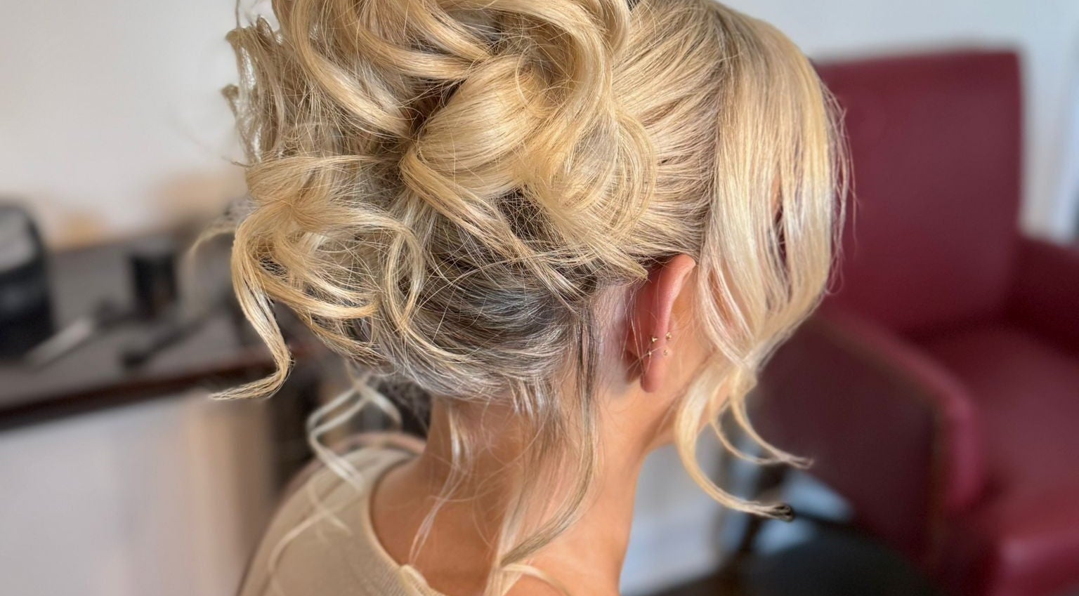 Blonde updo hairstyle at Gorgeous You Salon & Spa, Bridgeview, Illinois, US, highlighting expert styling.