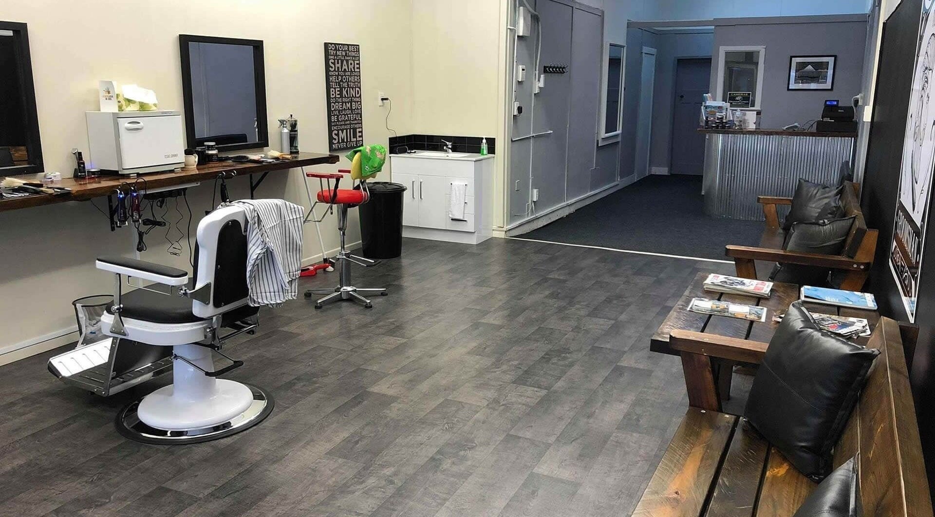 Modern barber chair and lounge area at The Groomsman LTD, Hāwera, Taranaki, NZ.