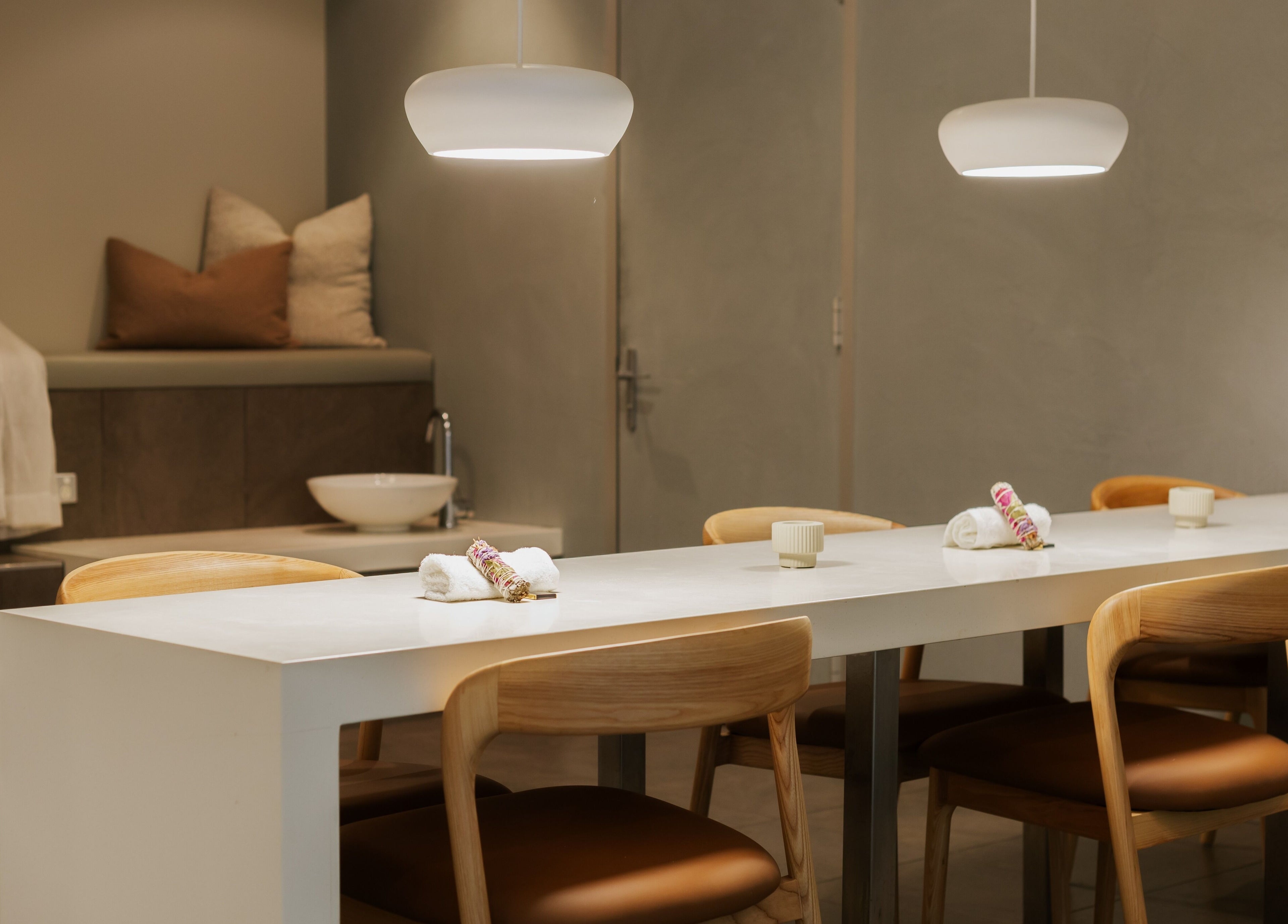 Relaxing treatment room at Solace Day Spa, Scarborough, Western Australia, AU with soft lighting and towels.