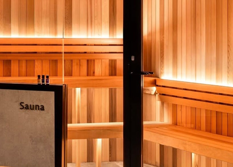 Relaxing sauna at Solace Day Spa in Scarborough, Western Australia, AU with inviting wooden benches and soft lighting.