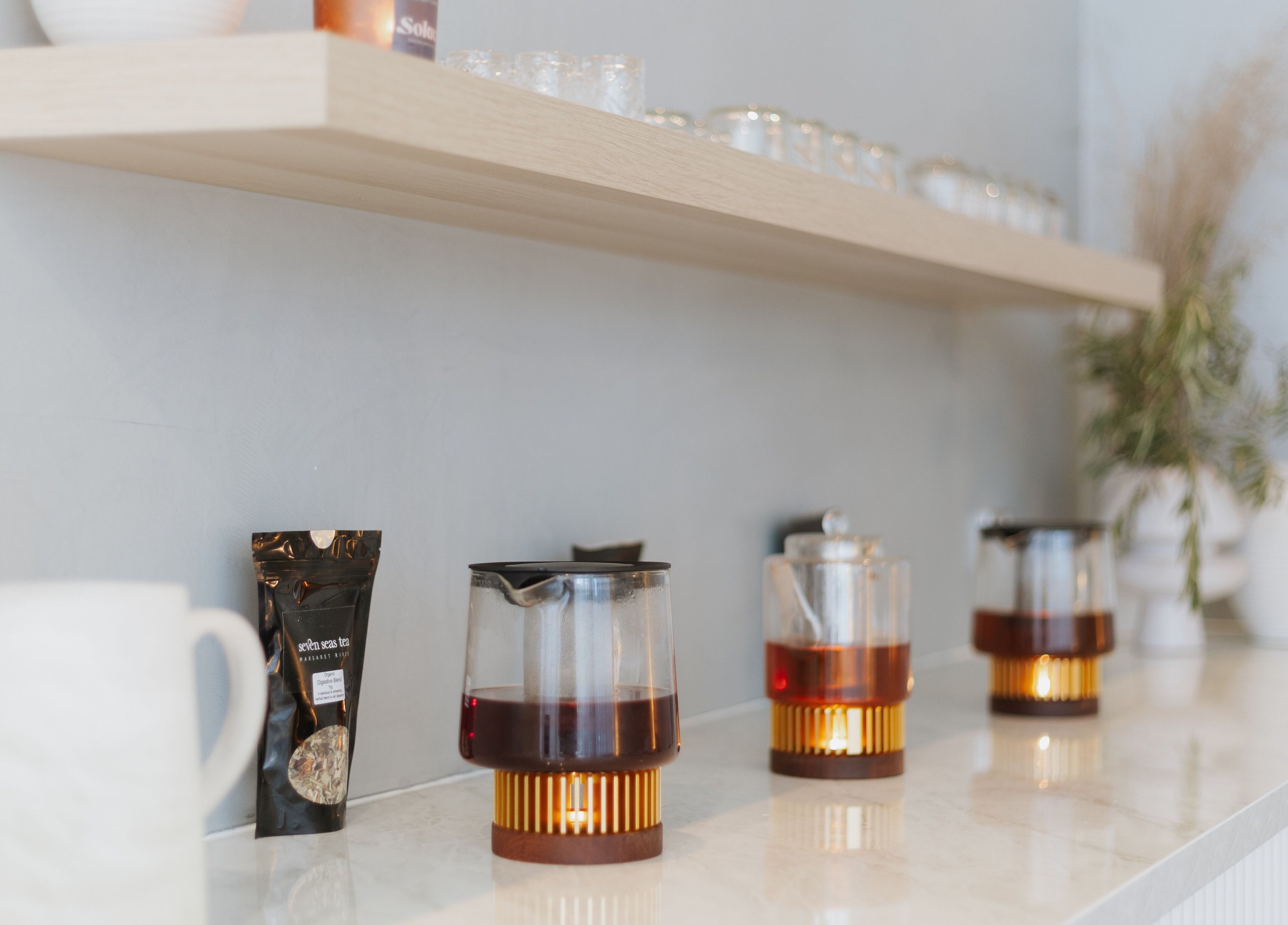 Teapots on a shelf at Solace Day Spa, Scarborough, Western Australia, AU, creating a serene atmosphere.
