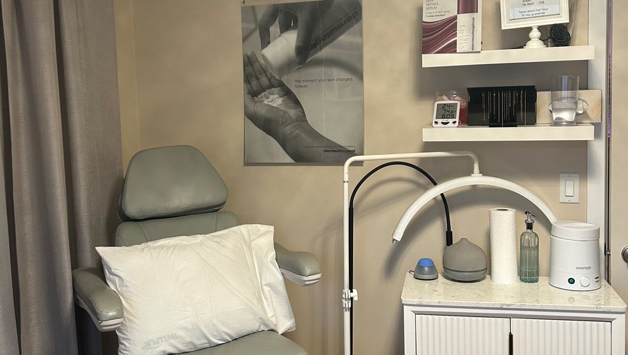 Cozy treatment room at Caring Esthetics, British Columbia, CA, with a comfy chair and skincare tools.
