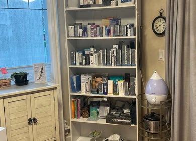 Skincare products on display at Caring Esthetics, British Columbia, CA enhancing a serene ambiance.