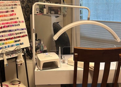 Manicure station with colorful nail polish selection at Caring Esthetics, British Columbia, British Columbia, CA.