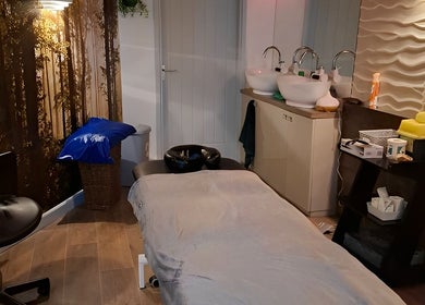 Restore & Align Massage Therapy, Mansfield, England. Cozy massage room with serene lighting and modern decor.