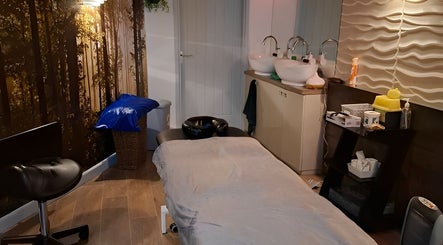 Restore & Align Massage Therapy, Mansfield, England. Cozy massage room with serene lighting and modern decor.
