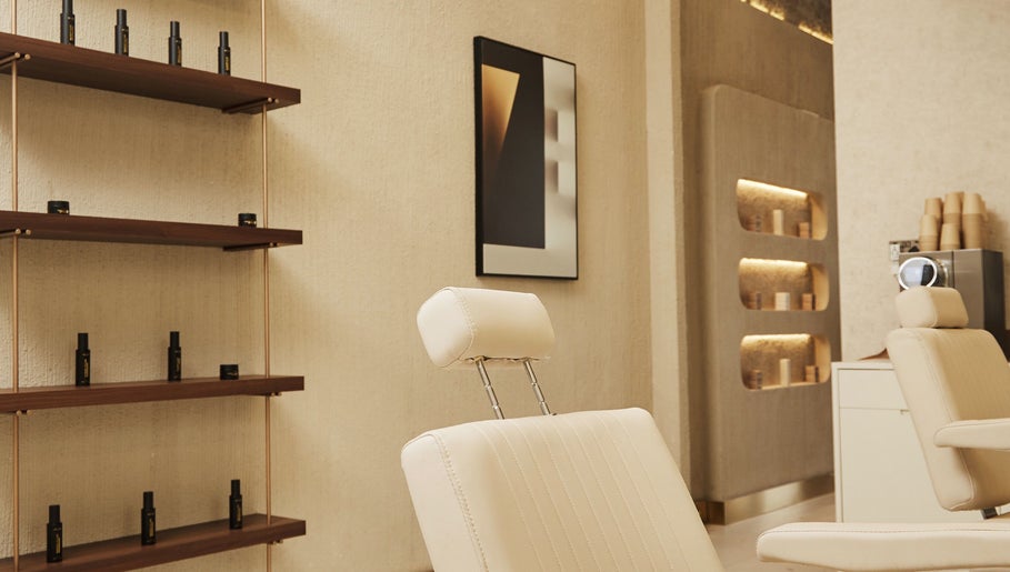 Sophisticated salon interior at Kochi Dubai Gents Salon, Dubai, Dubai, AE, with modern decor and comfortable seating.
