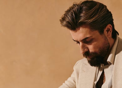 Stylish bearded man in a suit at Kochi Dubai Gents Salon, Dubai, Dubai, AE.