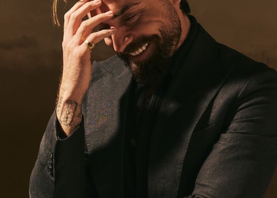 Elegant man in tailored suit at Kochi Dubai Gents Salon, Dubai, Dubai, AE—perfect grooming spot.