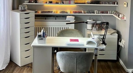 Pampered Beauty nail studio in Elphinstone, Scotland, GB, featuring modern manicure stations and organized polishes.