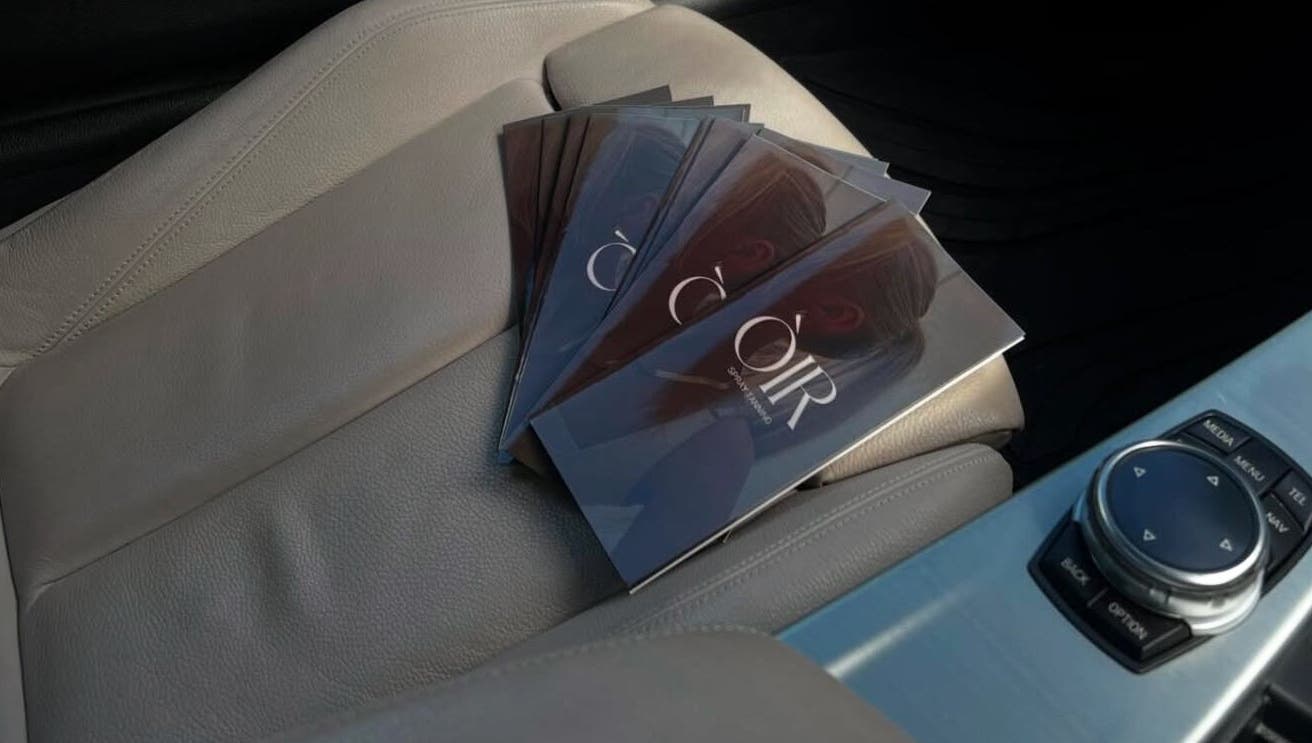Òir Spray Tanning brochures on car seat, Perth and Kinross, Scotland, GB.