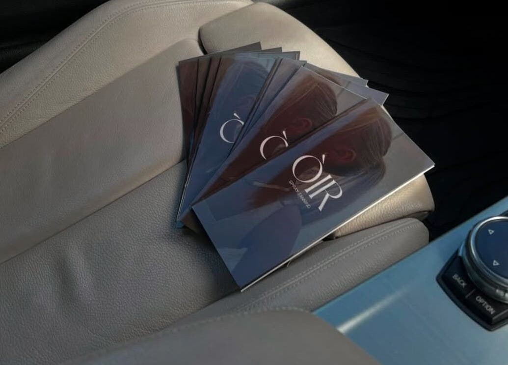 Òir Spray Tanning brochures on car seat, Perth and Kinross, Scotland, GB.