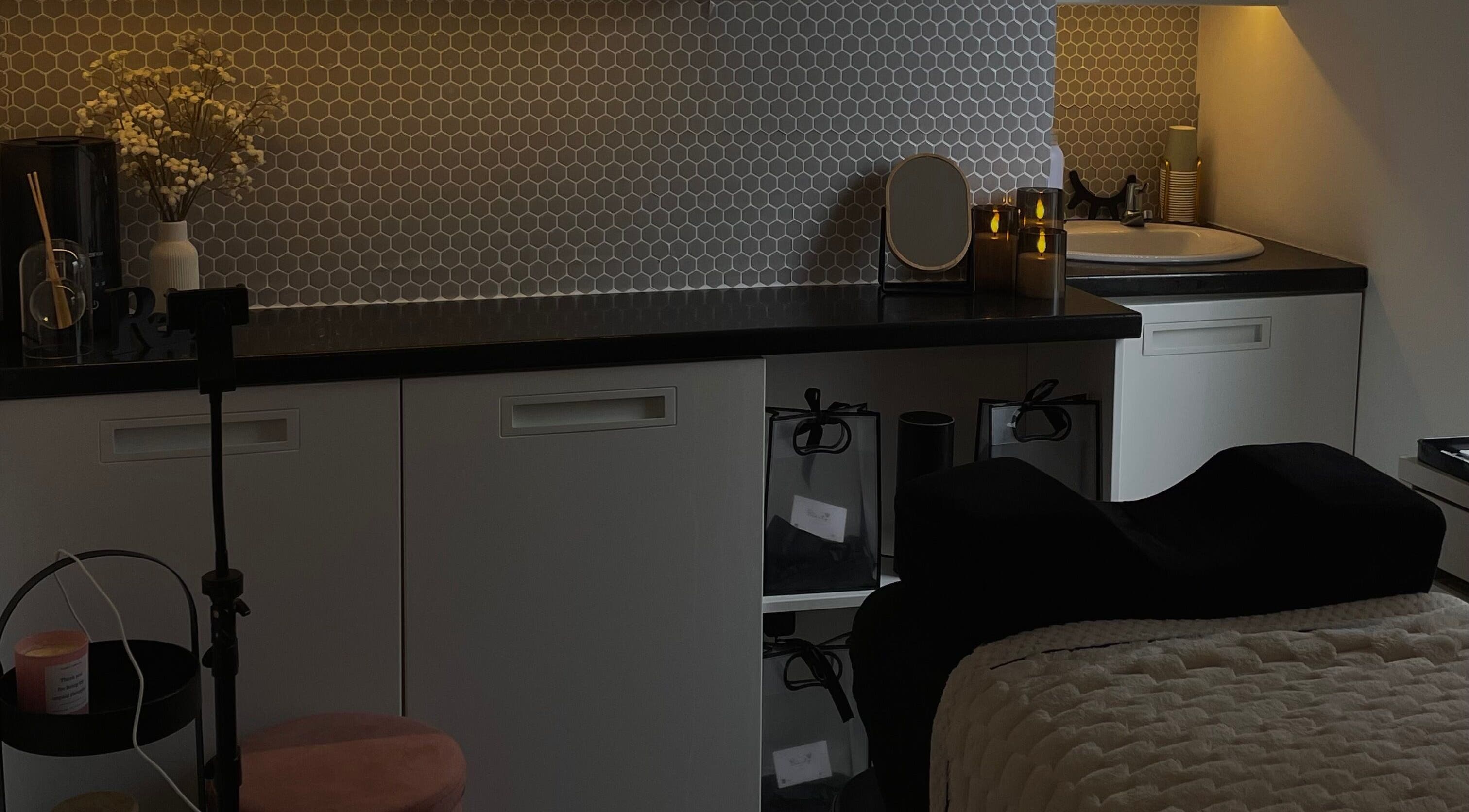 Relaxing treatment space at HB Beauty Hive, Dorridge, England, GB, featuring cozy lighting and modern design.