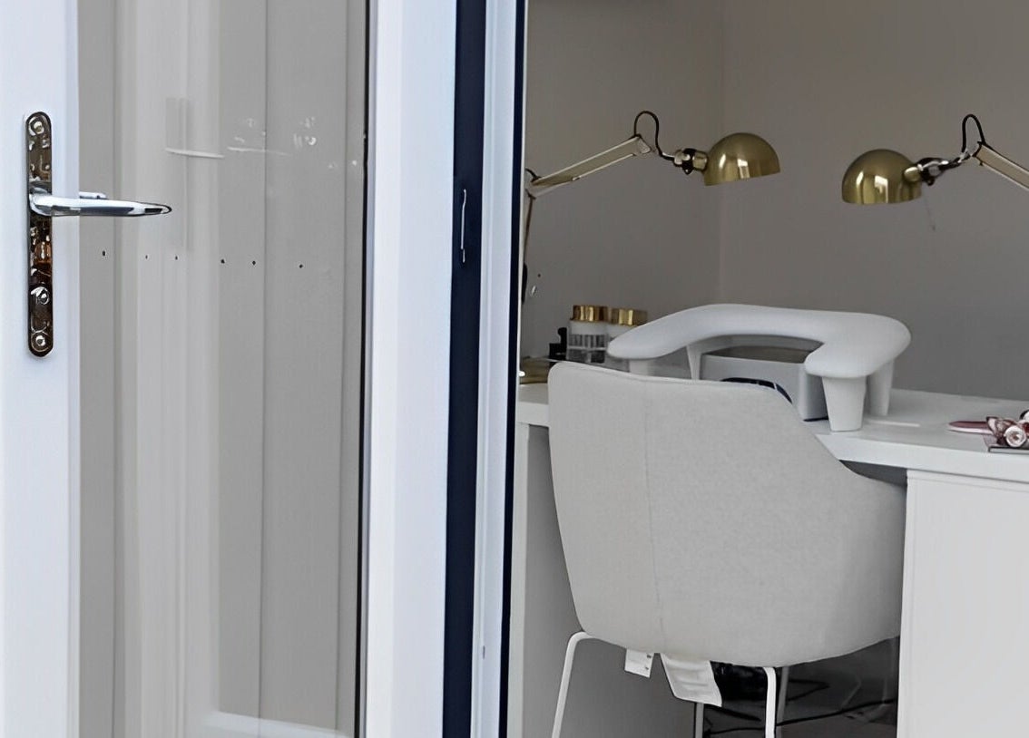 Manis By Mais in Epsom, England, GB showcases a chic nail station with a modern aesthetic.