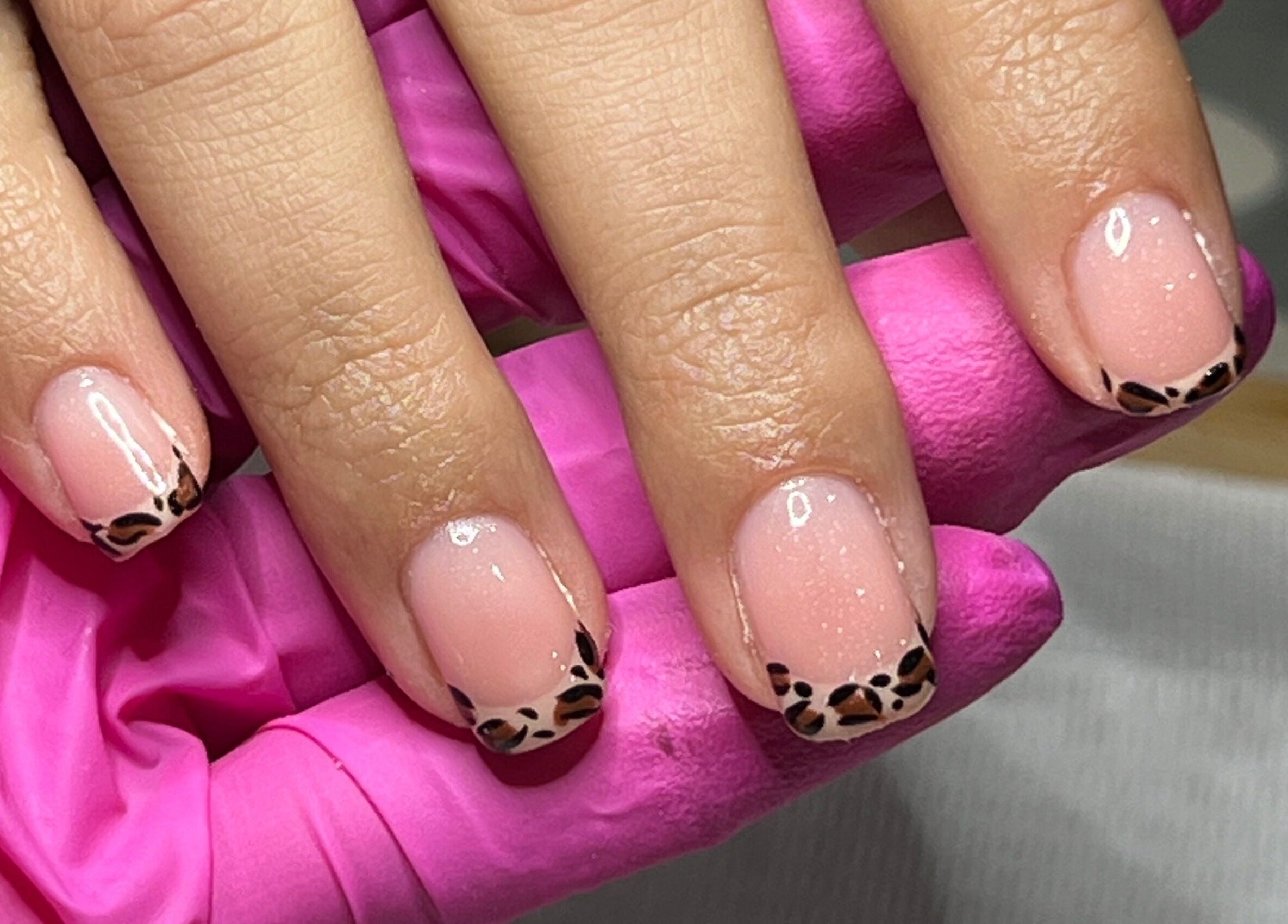 Elegant leopard print nail art at Manis By Mais, Epsom, England, GB. Perfectly manicured nails with unique design.
