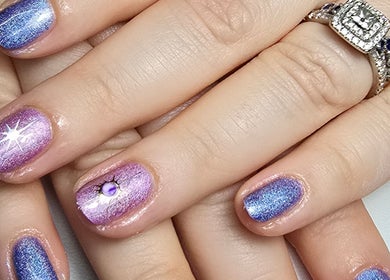 Vibrant purple and blue glitter nails by Nails by Nicole, Oughtibridge, England, GB.