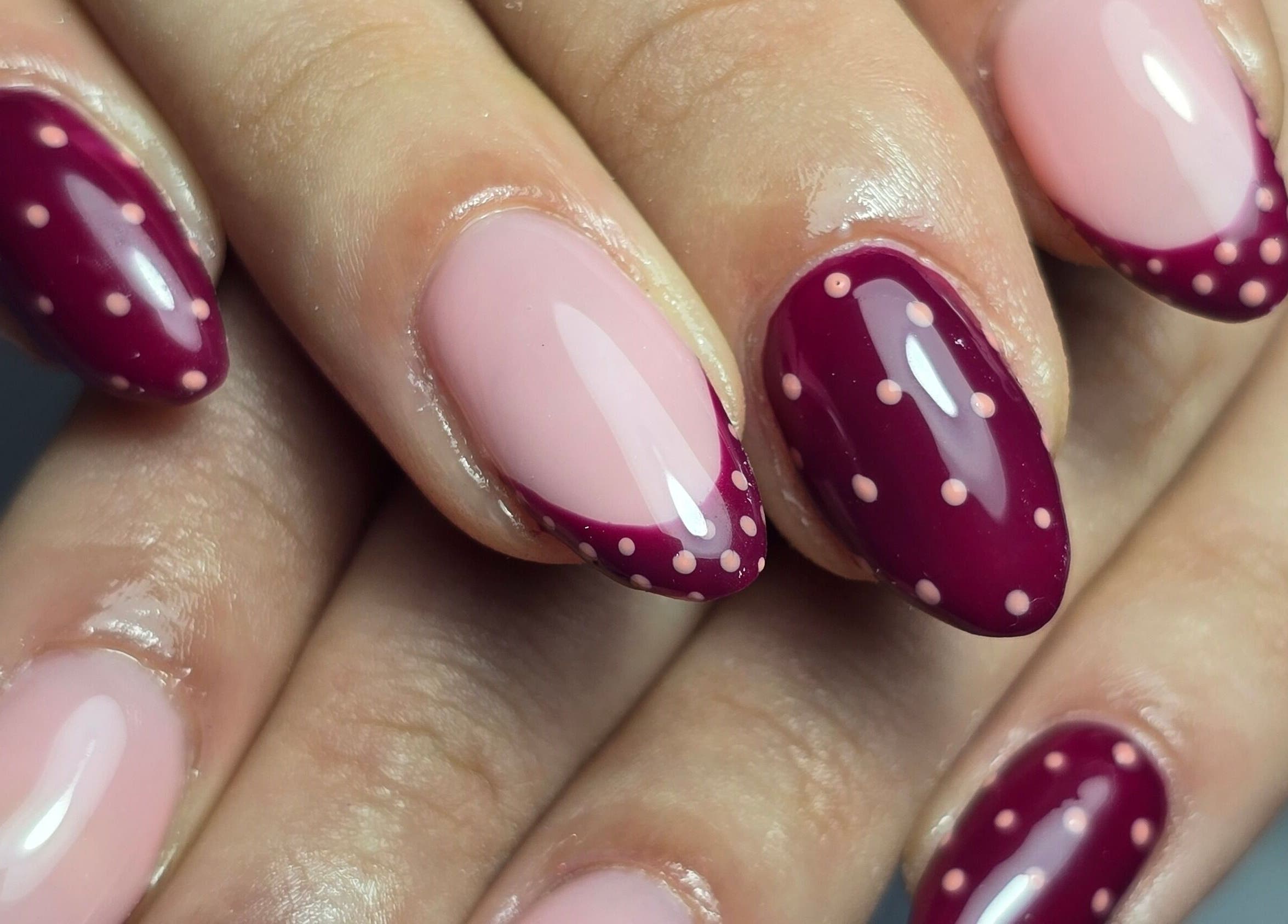 Elegant maroon and pink dotted manicure from Nails by Nicole in Oughtibridge, England, GB.
