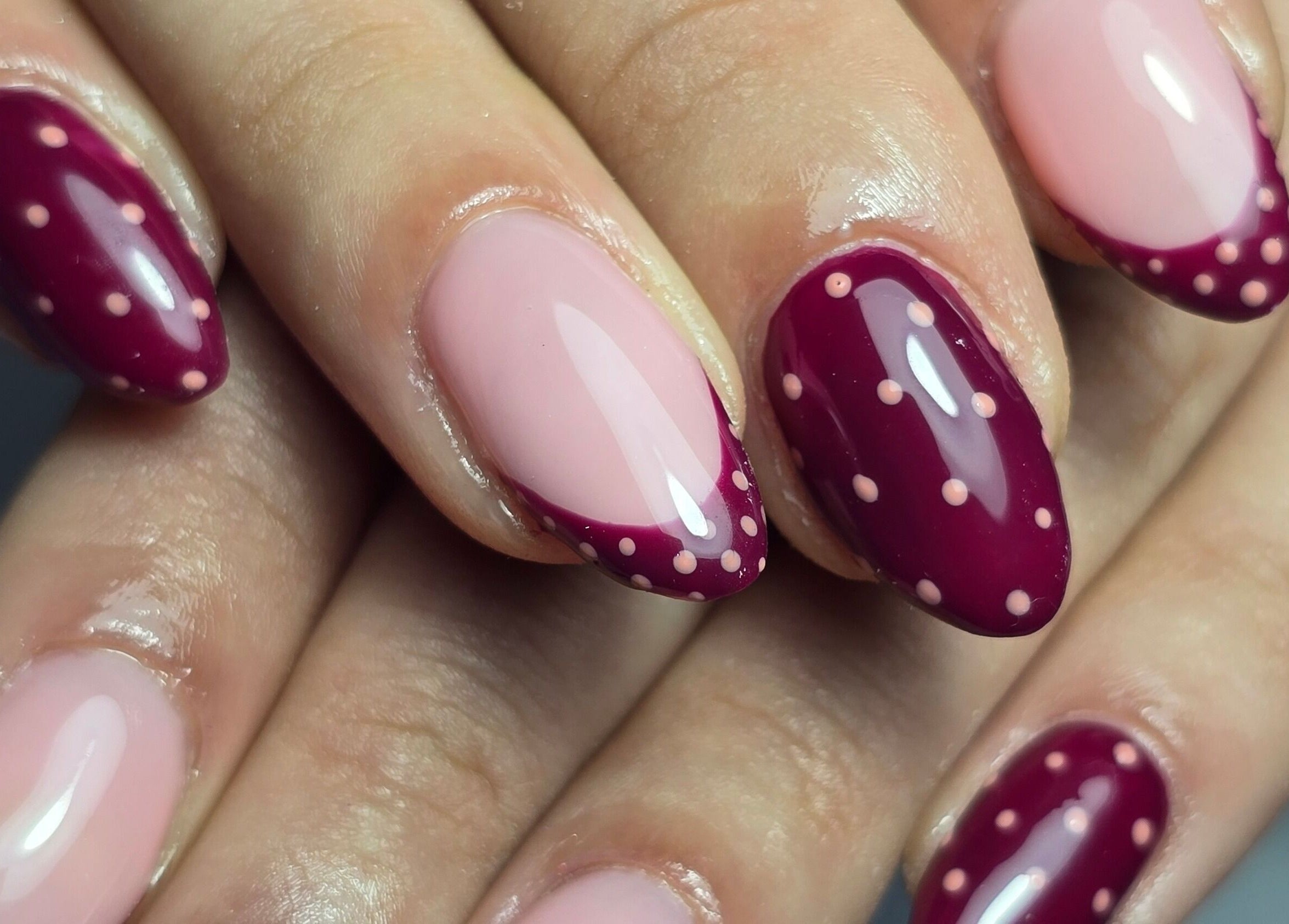 Elegant maroon and pink dotted manicure from Nails by Nicole in Oughtibridge, England, GB.