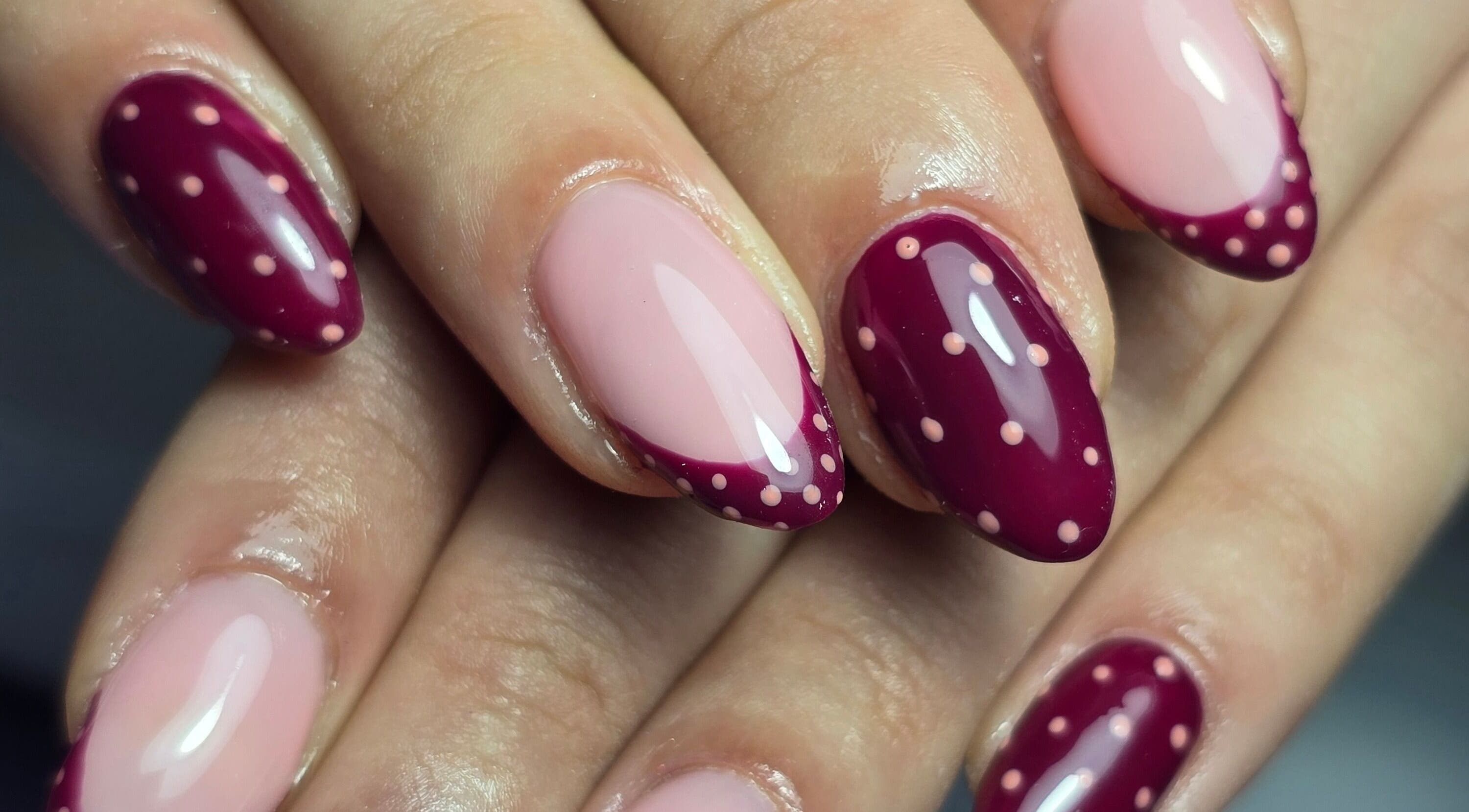 Elegant maroon and pink dotted manicure from Nails by Nicole in Oughtibridge, England, GB.