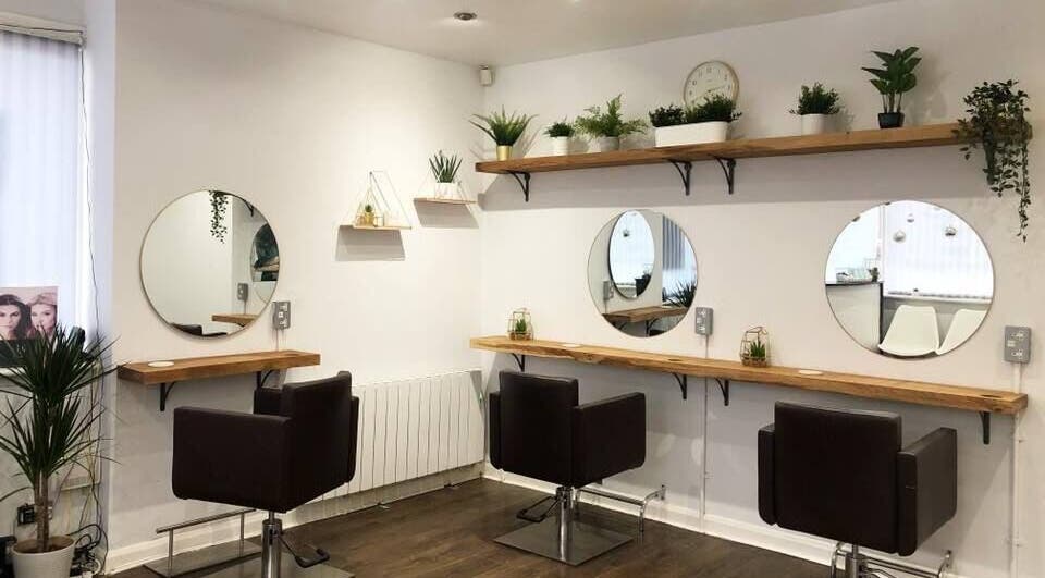 Modern salon chairs and mirrors at Teal Hair Design, Hull, England, GB.