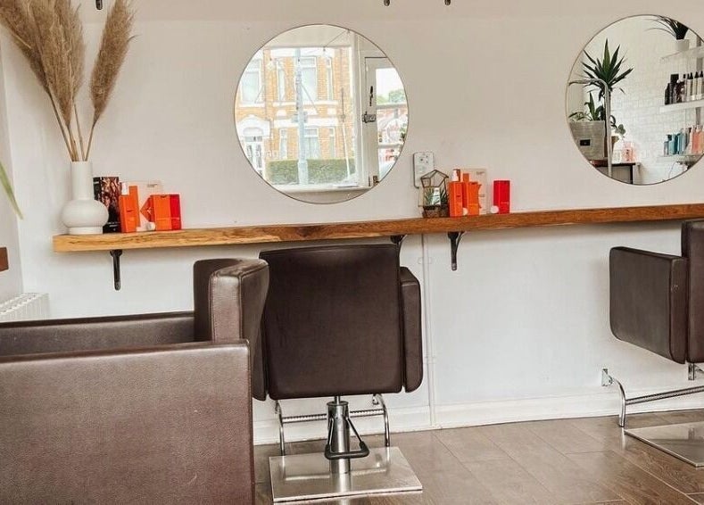 Modern salon chairs and mirrors at Teal Hair Design in Hull, England, GB.