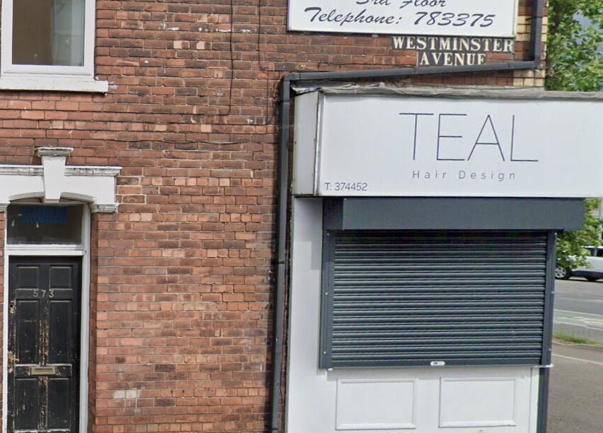 Front view of Teal Hair Design, Hull, England, GB, featuring a stylish signage and brick structure.