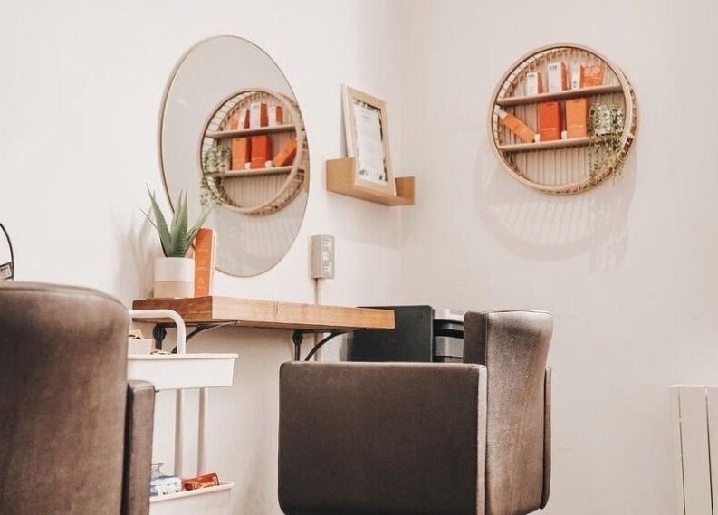 Elegant salon space at Teal Hair Design, Hull, England, GB with modern mirrors and comfortable seating.