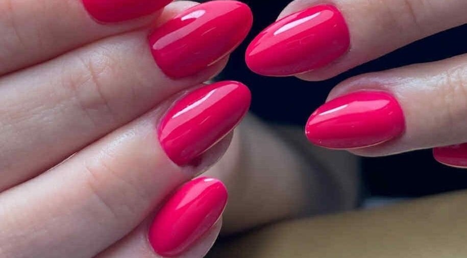 Bright pink gel nails at ŻanaNailsStudio, Edinburgh, Scotland, GB, showcasing expert nail artistry.