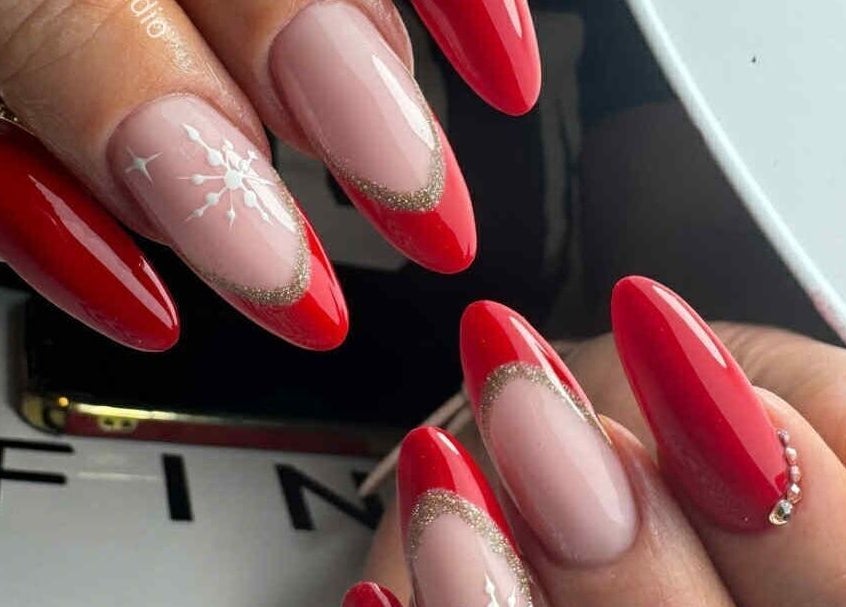 Elegant red nail art design at ŻanaNailsStudio, Edinburgh, Scotland, GB showcasing intricate seasonal patterns.