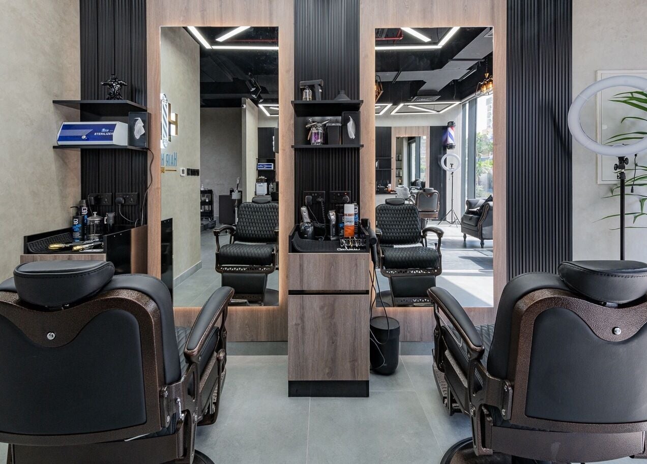 Elegant and modern interior of Hair Hunchos Barbers, Dubai, Dubai, AE with premium barber chairs.