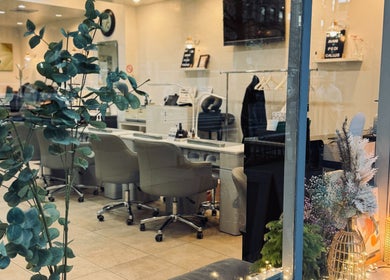 View of New L&T Nail Spa INC in New York, featuring elegant decor and comfortable seating for a relaxing experience.