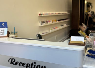 Reception at New L&T Nail Spa INC with nail polish on shelves in New York, New York, US.