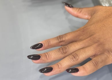 Elegant dark polished nails at New L&T Nail Spa INC, New York, New York, US showcasing manicured beauty.