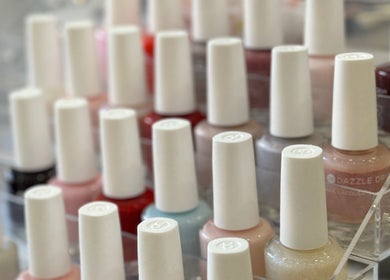 Colorful nail polish display at New L&T Nail Spa INC in New York, New York, US.