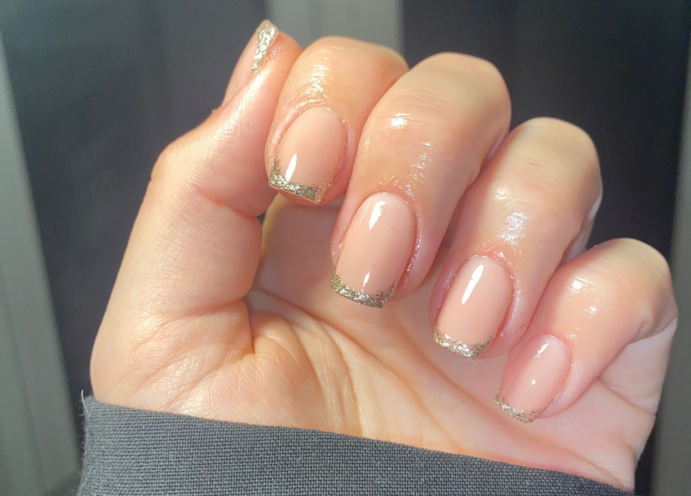 Elegant manicure with glitter tips at Glos Nails by April in Shirley, England, GB.