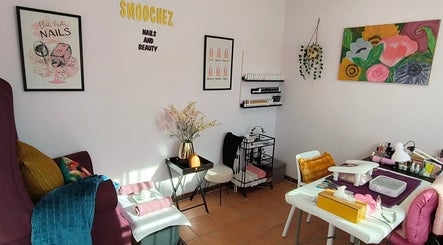 Chic interior of Smoochez Nails and Beauty in Cape Town, Western Cape, ZA, featuring nail care stations and decor.