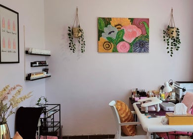 A serene nail care room at Smoochez Nails and Beauty, Cape Town, Western Cape, ZA, with plants and vibrant wall art.