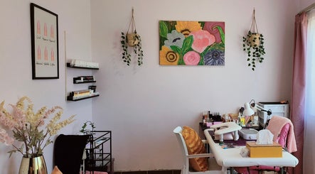 A serene nail care room at Smoochez Nails and Beauty, Cape Town, Western Cape, ZA, with plants and vibrant wall art.