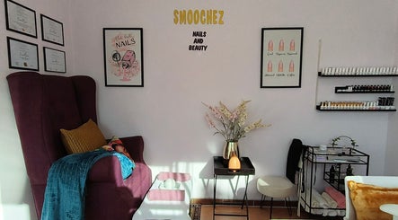 Chic interior of Smoochez Nails and Beauty in Cape Town, Western Cape, ZA, featuring plush seating and nail polish display.