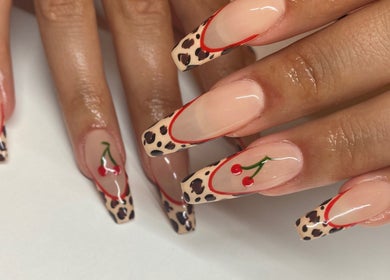 Cherry and leopard nail art at Lozzy Nails, Brentwood, England, GB, showcasing creativity and style.
