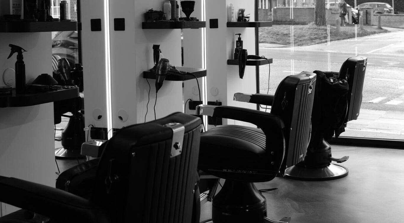 Stylish salon interior with black chairs at The Cut - Locksbottom, Orpington, England, GB.
