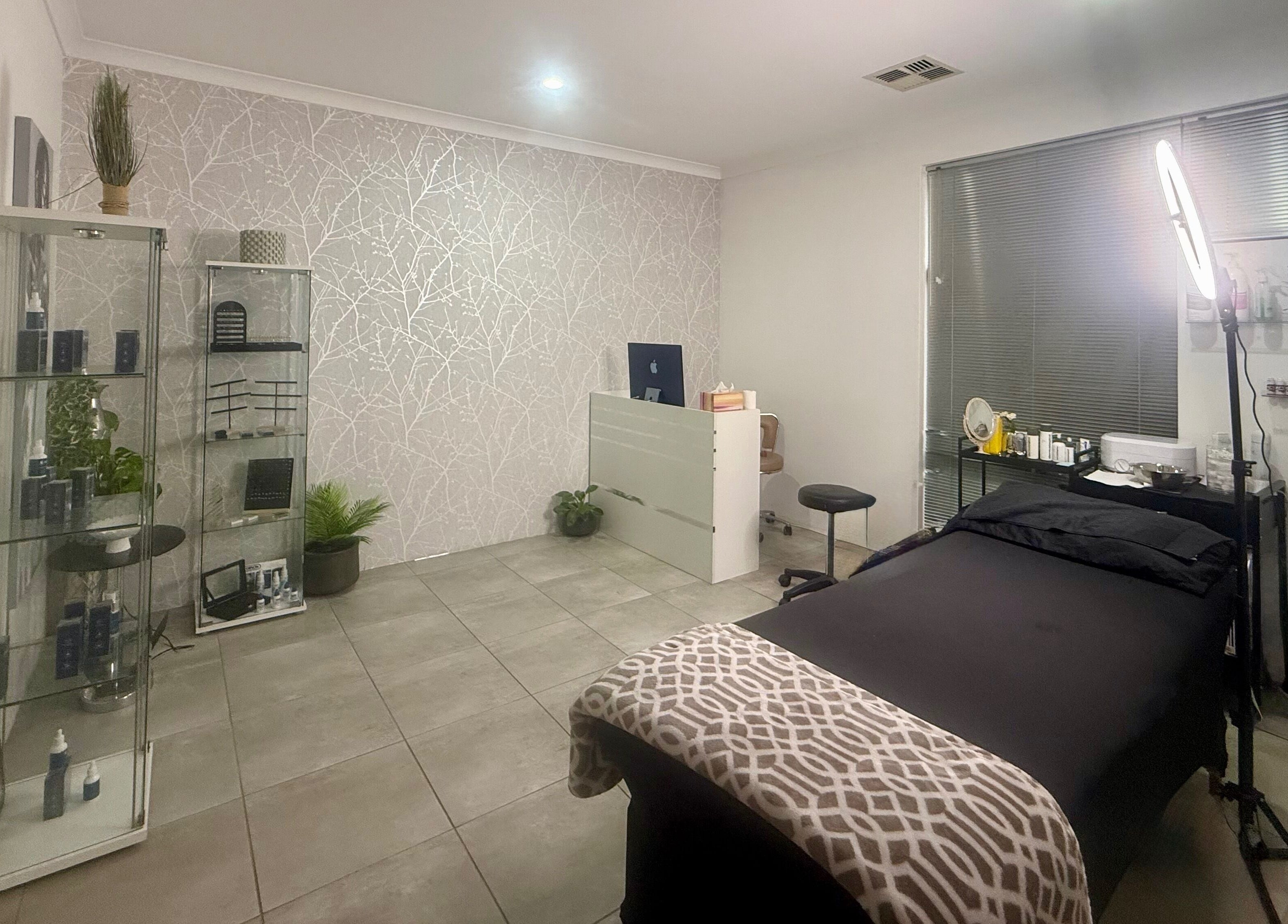 Calming beauty room at Nrich Glow in Brabham, Western Australia, AU featuring a treatment bed and modern decor.