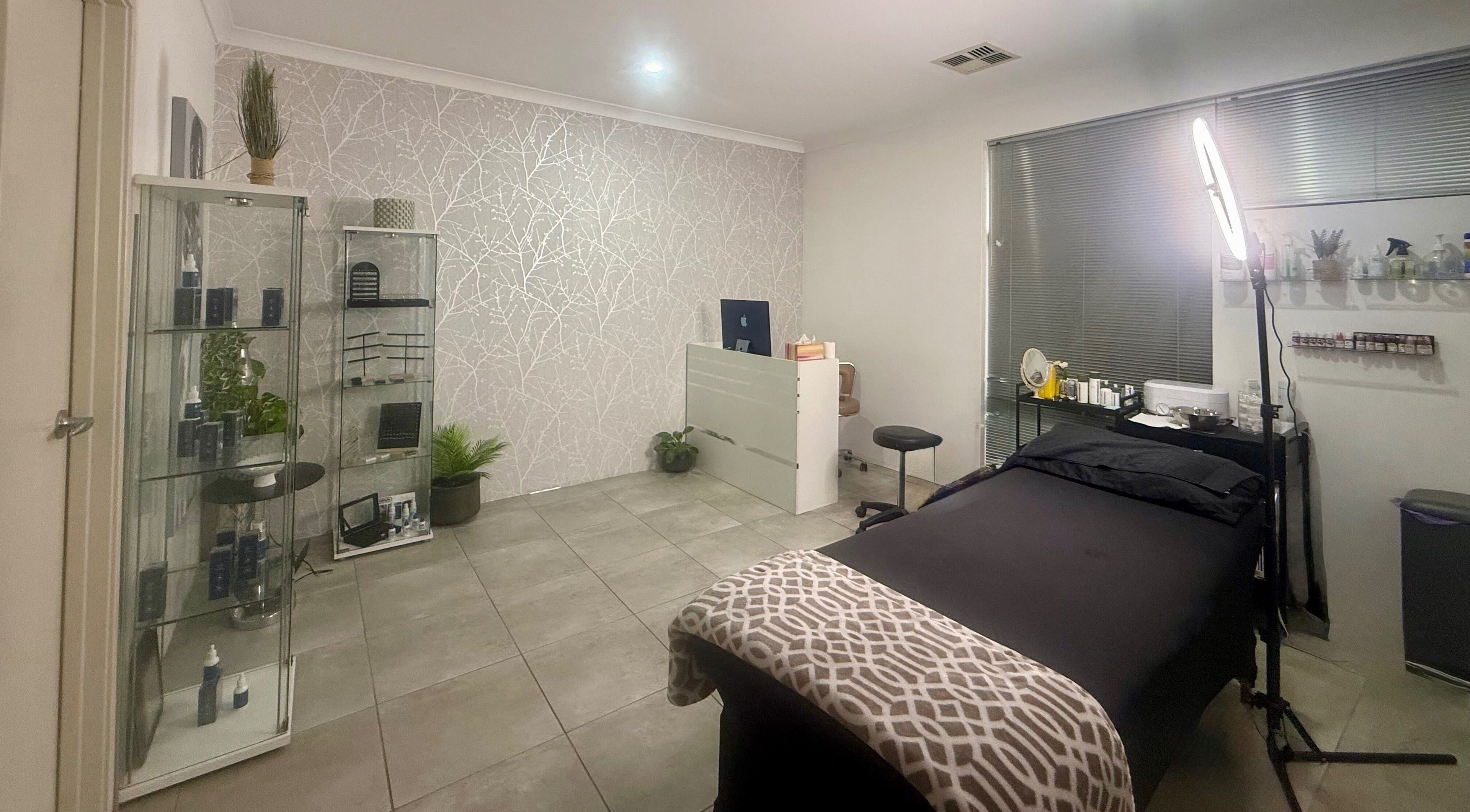 Calming beauty room at Nrich Glow in Brabham, Western Australia, AU featuring a treatment bed and modern decor.