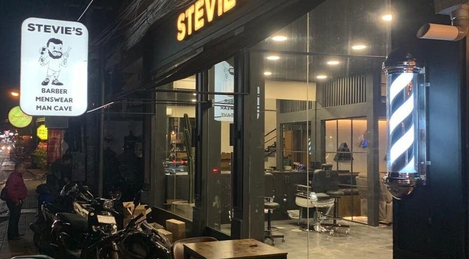 Stevie's Barber shop exterior in Bali, Bali, ID, featuring sleek design and illuminated barber pole.