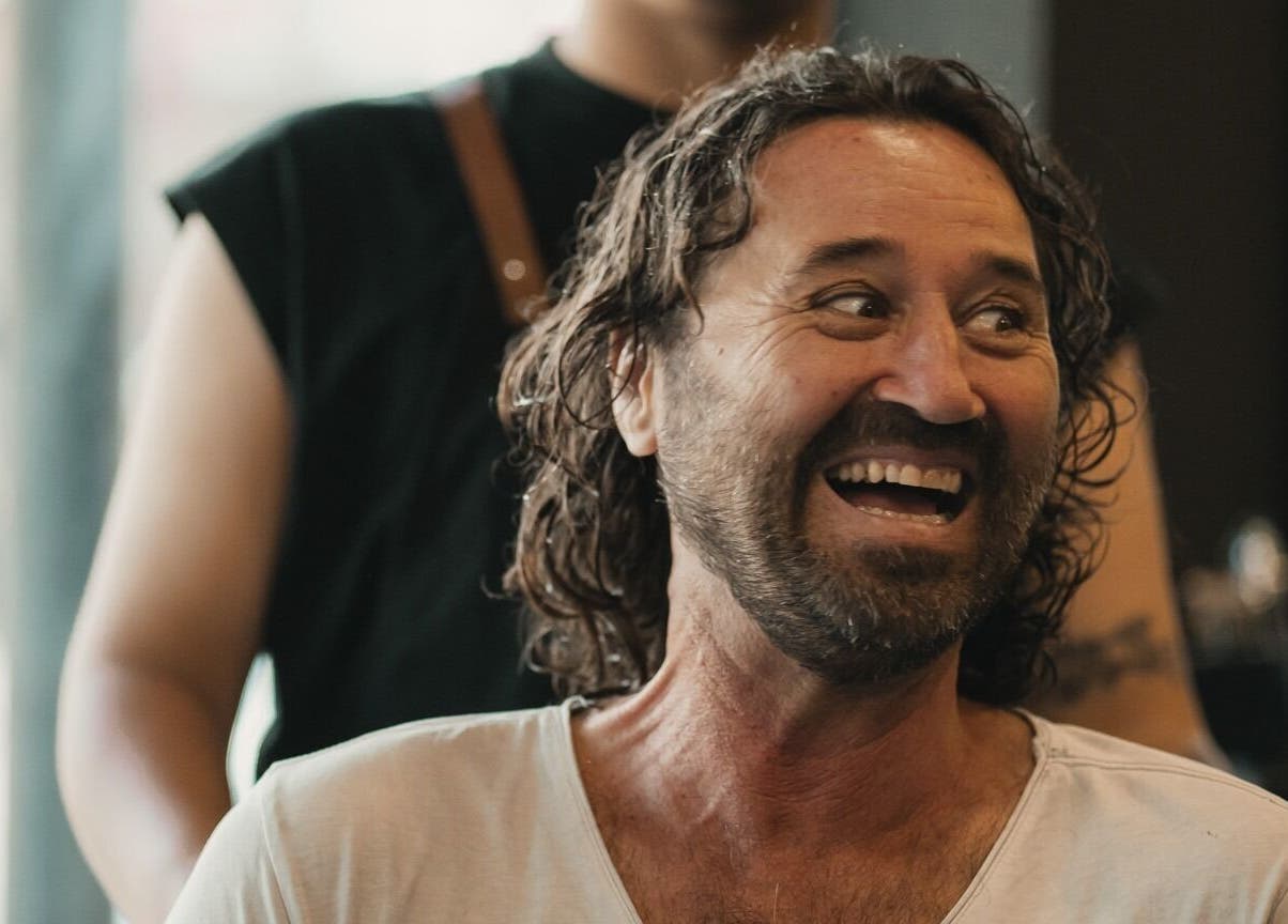 Happy client enjoying a haircut at Stevie's salon, Bali, Bali, ID.