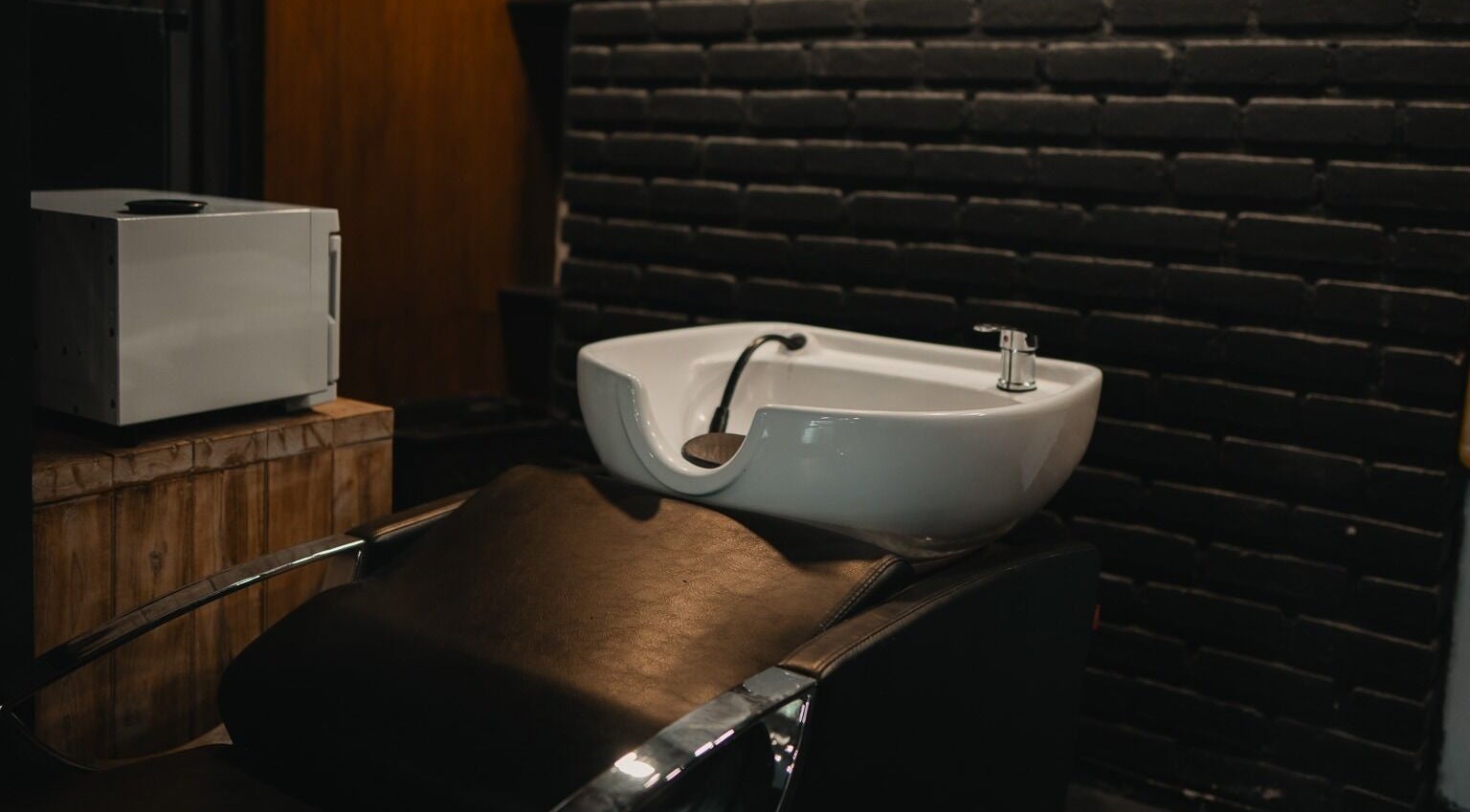 Luxurious hair washing station at Stevie's salon in Bali, Bali, ID, featuring modern design and comfort.