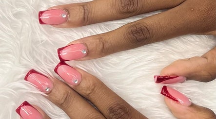 Elegant nail art with red tips at Princie Beauty, Johannesburg, Gauteng, ZA. Perfect for stylish looks.