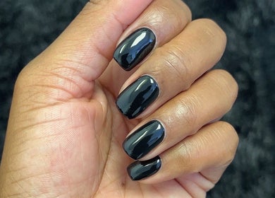 Elegant black manicured nails at Princie Beauty in Johannesburg, Gauteng, ZA, showcasing salon expertise.