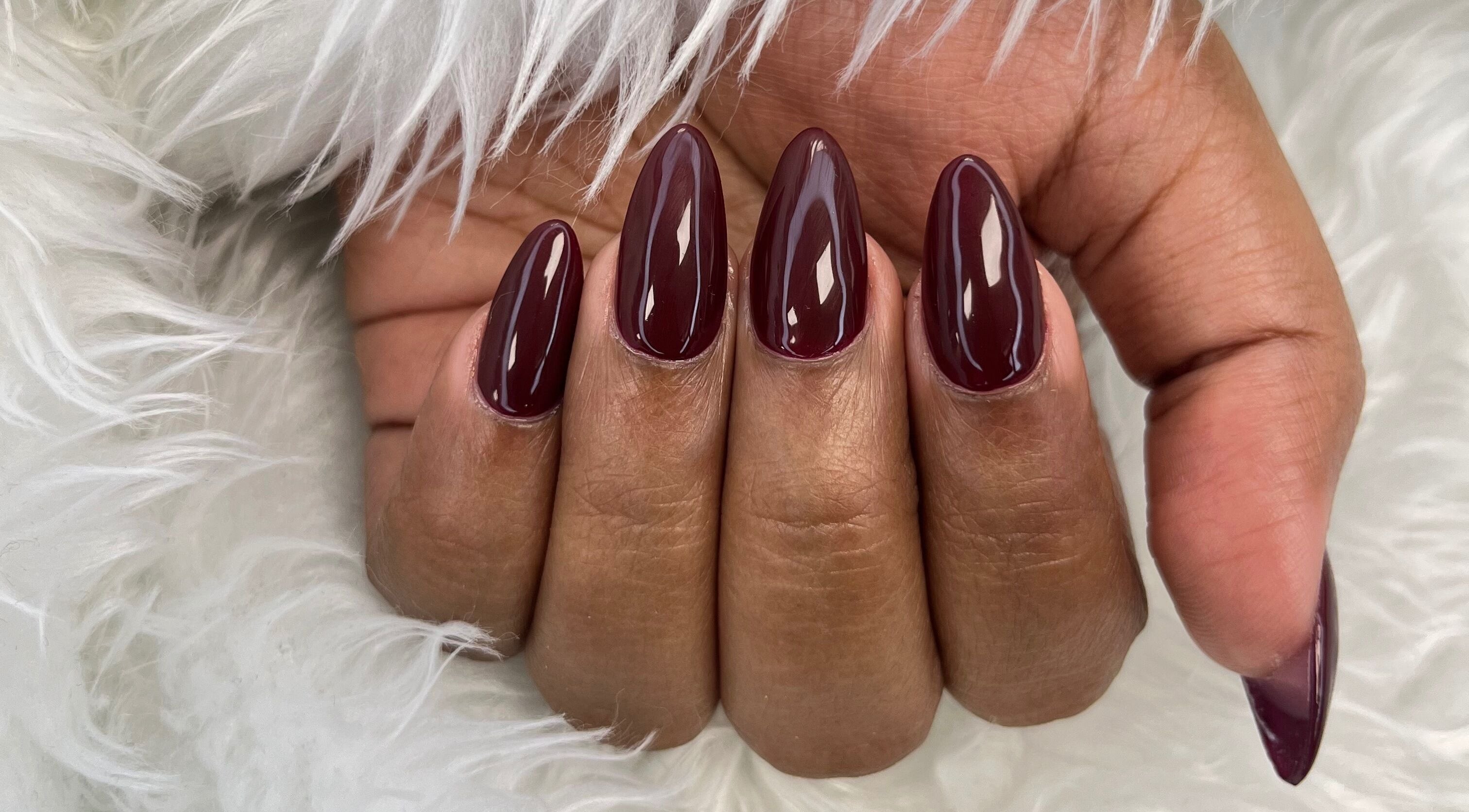 Bordeaux manicured nails at Princie Beauty, Johannesburg, Gauteng, ZA, showcasing elegance and style.