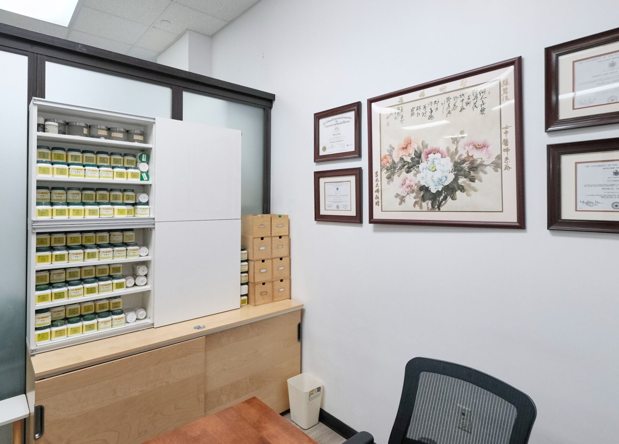 Shelves of herbal products and framed art at HealthKey Group Wellington - Manhattan, New York, US.